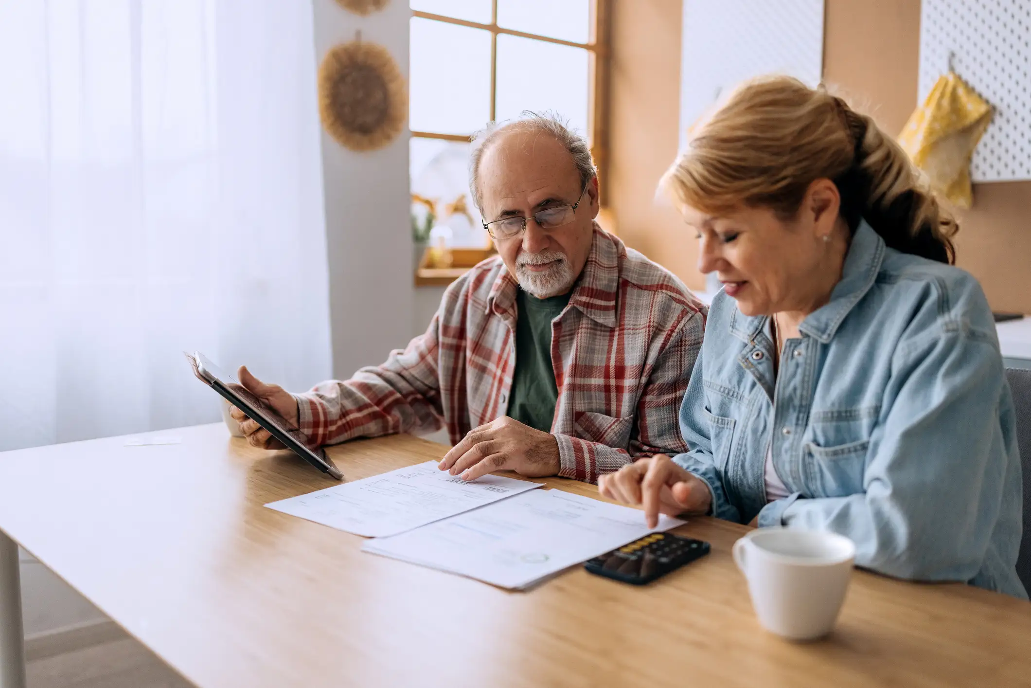 Senior couple reviewing their finances